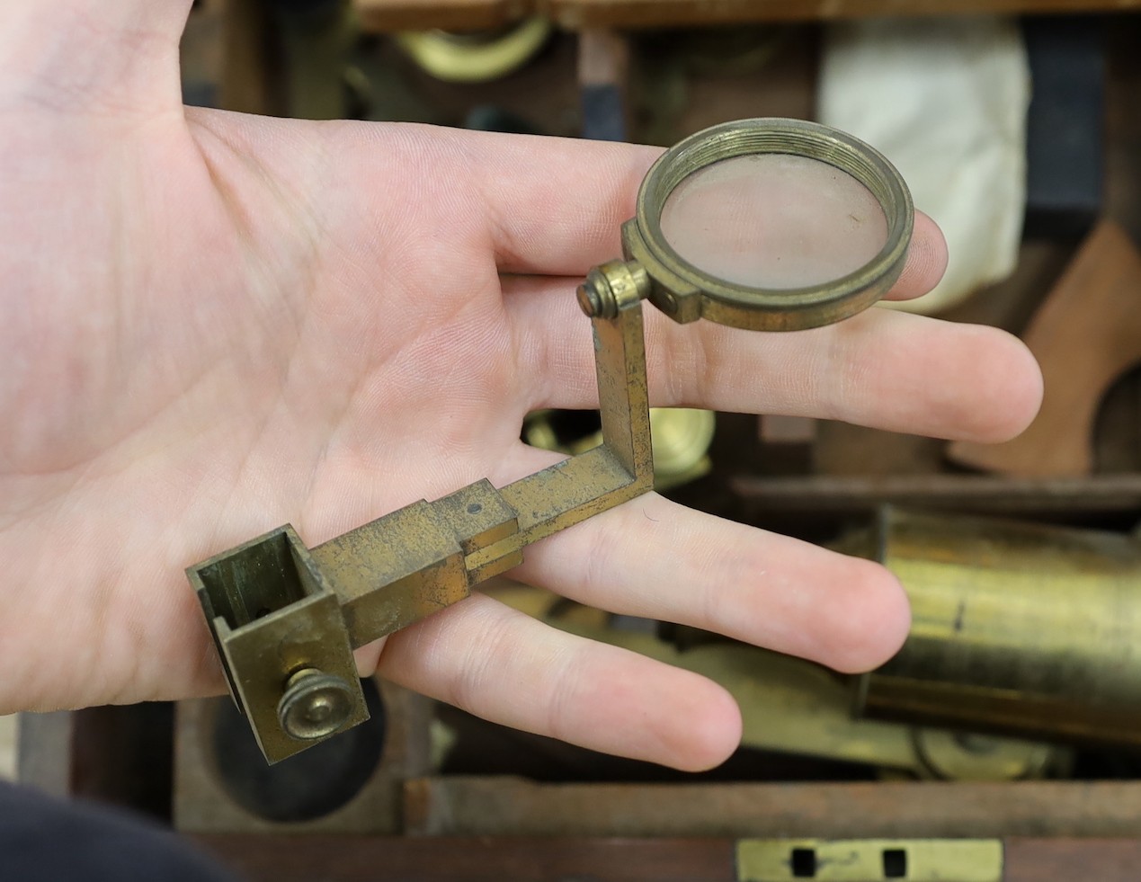 A 19th century cased brass monocular microscope